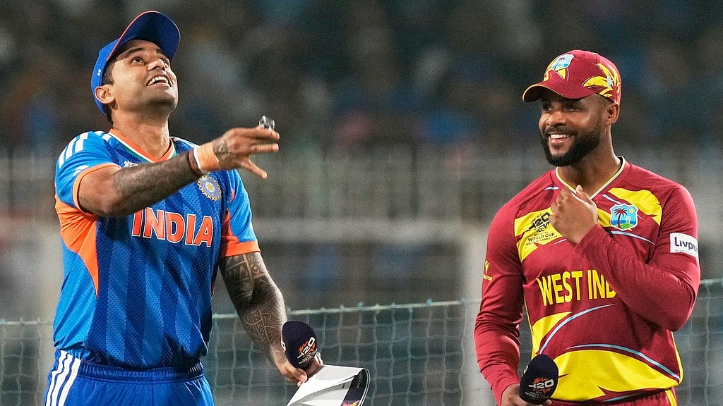 India's captain Suryakumar Yadav, left, tosses the coin as West Indies' captain Shai Hope looks on before the start of the T20 World Cup match between India and West Indies in Kolkata. - Photo: AP