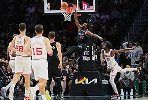 | Photo: AP/Lynne Sladky : Miami Heat forward Andrew Wiggins (22) dunks over Houston Rockets forward Tari Eason (17) during the second half of an NBA basketball game, in Miami.
