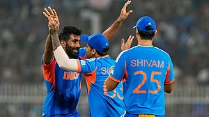 | Photo: AP/Bikas Das : India's Jasprit Bumrah, left, celebrates with captain Suryakumar Yadav the wicket of West Indies' Roston Chase during the T20 World Cup cricket match between India and West Indies in Kolkata.