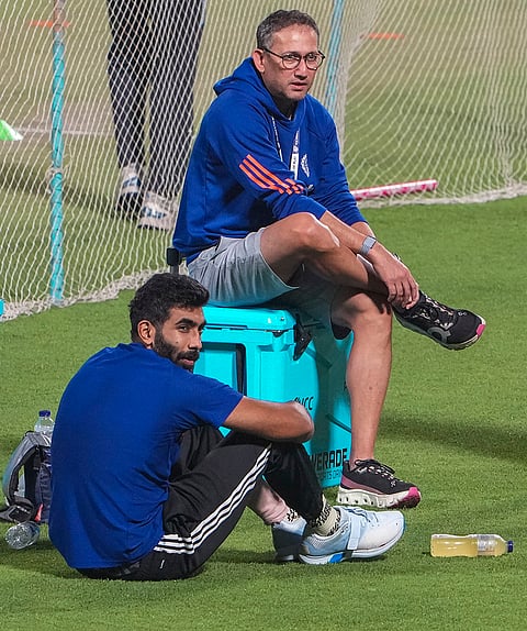 India's Jasprit Bumrah, front, and BCCI senior men’s selection committee chairman Ajit Agarkar during a practice session ahead of an ICC Men's T20 World Cup 2026 cricket match between India and West Indies, at the Eden Gardens, in Kolkata, West Bengal.