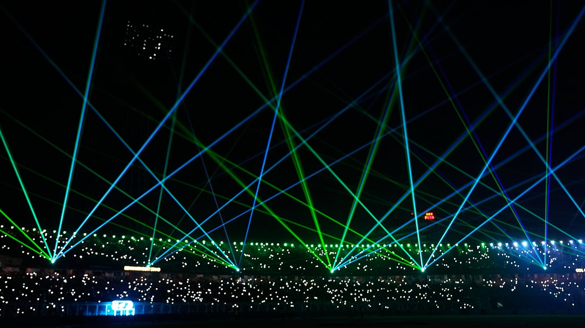 A laser show entertains the spectators during a drinks break of the T20 World Cup cricket match between India and West Indies in Kolkata, India, Sunday, March 1, 2026 - (AP Photo/Bikas Das)