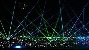 (AP Photo/Bikas Das) : A laser show entertains the spectators during a drinks break of the T20 World Cup cricket match between India and West Indies in Kolkata, India, Sunday, March 1, 2026