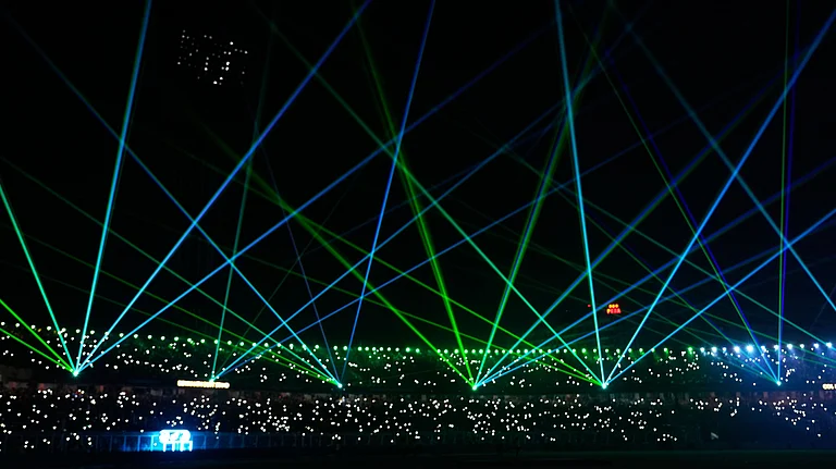 A laser show entertains the spectators during a drinks break of the T20 World Cup cricket match between India and West Indies in Kolkata, India, Sunday, March 1, 2026 - (AP Photo/Bikas Das)