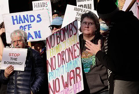 Protesters gather against the US bombing of Iran at Pike Place Market in Seattle.