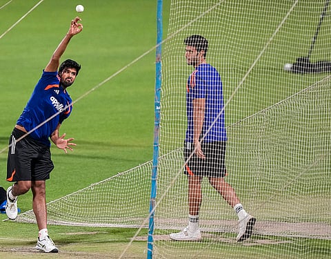 India's Washington Sundar bowls a delivery as Shivam Dube watches during a practice session ahead of an ICC Men's T20 World Cup 2026 cricket match between India and West Indies, at the Eden Gardens, in Kolkata, West Bengal.