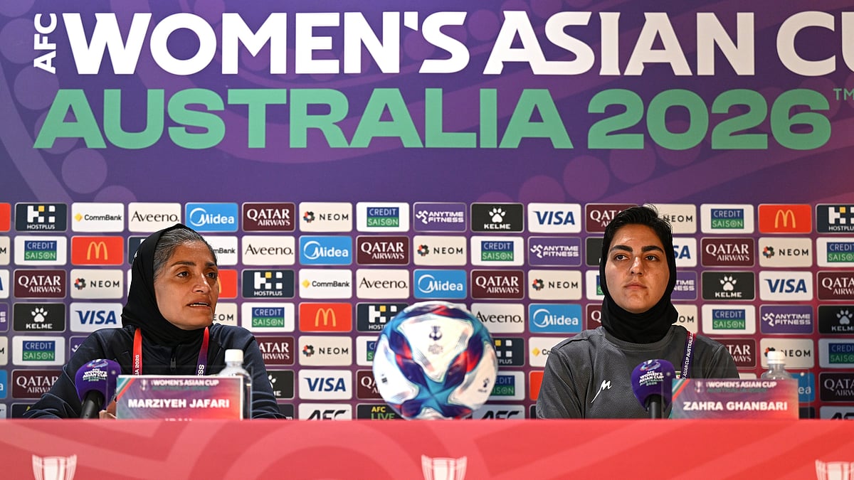 Iranian women's national soccer team coach Marziyeh Jafari, left, and captain Zahra Ghanbari react during a press conference ahead of their game against South Korea on Monday at Robina Stadium on the Gold Coast, Australia, Sunday, March 1, 2026.  - | Photo: AP/DAVE HUNT