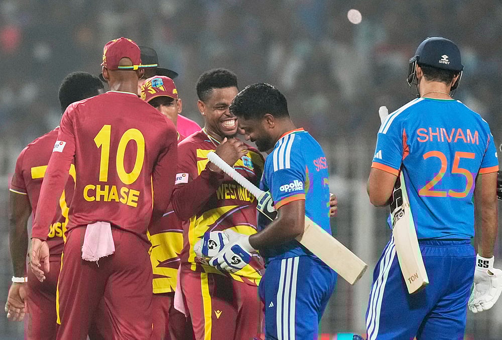 West Indies' Shimron Hetmyer, center, chats with India's Sanju Samson after India won the T20 World Cup cricket match against West Indies in Kolkata. - | Photo: AP/Bikas Das