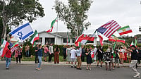 Iran At FIFA World Cup 2026: Will Team Melli Participate After US-Israel's Joint Strike? Here's Everything We Know | Photo: Mick Tsikas/AAP Image via AP : Iranian Australians react outside Iran's embassy in Canberra, Australia.
