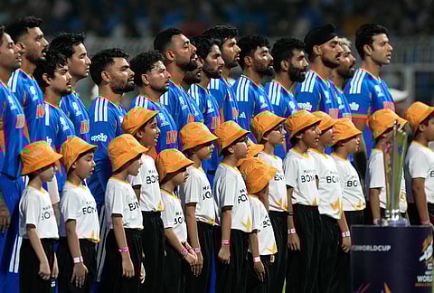 India's players stand up for the national anthems before the start of the T20 World Cup cricket match between India and West Indies in Kolkata.