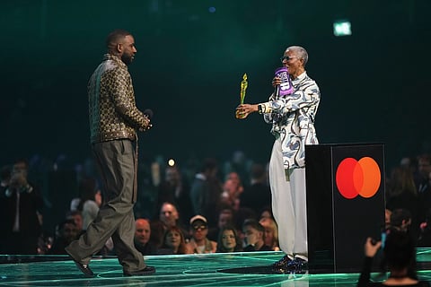 DJ Paulette, right presents the Best Dance Act Award to Skepta, left, during the Brit Awards 2026 in Manchester, England.