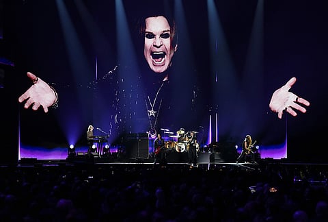 Robbie Williams, centre right performs during the Brit Awards 2026 in Manchester, England.