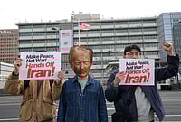 | Photo: AP/Ahn Young-joon : A South Korean protester wearing a mask of U.S. President Donald Trump attends a press conference denouncing the U.S. and Israel's attack on Iran, near the U.S. Embassy in Seoul, South Korea.