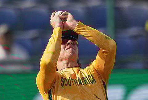 South Africa's Dewald Brevis takes the catch to dismiss Zimbabwe's Dion Myers during the T20 World Cup cricket match between South Africa and Zimbabwe in New Delhi.