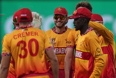 South Africa's players celebrate the wicket of South Africa's Ryan Rickelton during the T20 World Cup cricket match between South Africa and Zimbabwe in New Delhi.