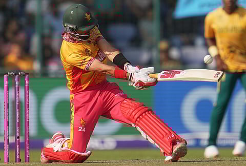 Zimbabwe's captain Sikandar Raza hits a six during the T20 World Cup cricket match between South Africa and Zimbabwe in New Delhi.