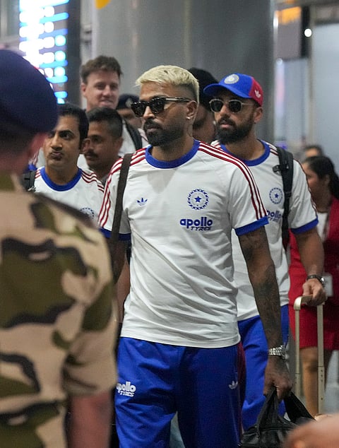 India's Hardik Pandya with teammates leaves from the airport after the team's arrival for the ICC Men's T20 World Cup 2026 cricket match against West Indies, in Kolkata.