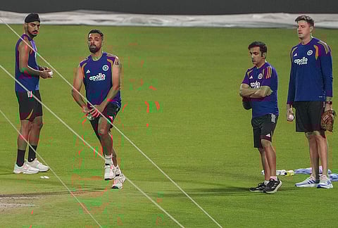 From left, India's Arshdeep Singh, Varun Chakravarthy, head coach Gautam Gambhir and bowling coach Morne Morkel during a practice session ahead of an ICC Men's T20 World Cup 2026 cricket match between India and West Indies, at the Eden Gardens, in Kolkata, West Bengal.
