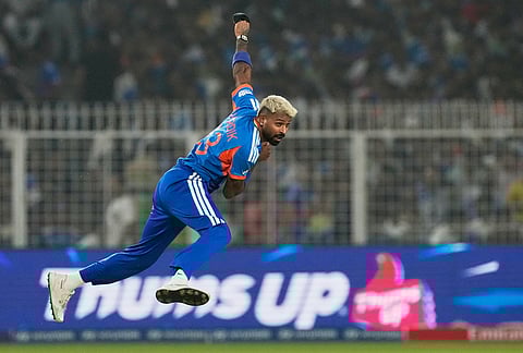 India's Hardik Pandya bowls a delivery during the T20 World Cup cricket match between India and West Indies in Kolkata.