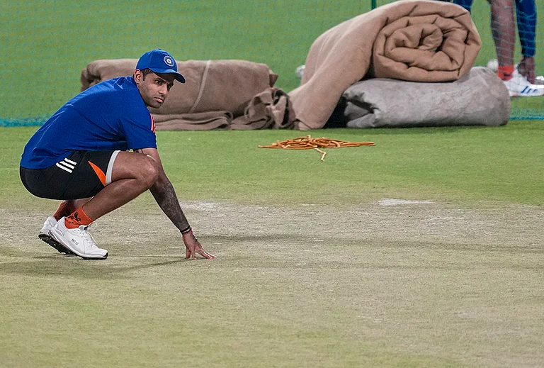 India's captain Suryakumar Yadav inspects the pitch during a practice session ahead of an ICC Men's T20 World Cup 2026 cricket match between India and West Indies, at the Eden Gardens, in Kolkata, West Bengal. - | Photo: PTI/Swapan Mahapatra