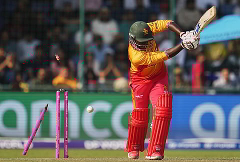 Zimbabwe's Tony Munyonga is bowled out by South Africa's Corbin Bosch during the T20 World Cup cricket match between South Africa and Zimbabwe in New Delhi.