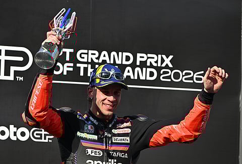 MotoGP winner Italy's rider Marco Bezzecchi celebrates on the podium after the MotoGP at the Chang International Circuit in Buriram, Thailand.