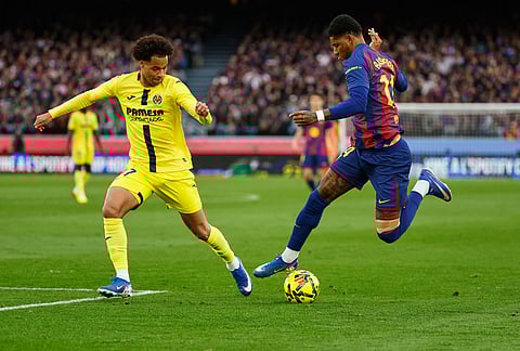 Barcelona's Marcus Rashford, right, and Villarreal's Tajon Buchanan compete for the ball during the Spanish La Liga soccer match between Barcelona and Villareal in Barcelona, Spain.