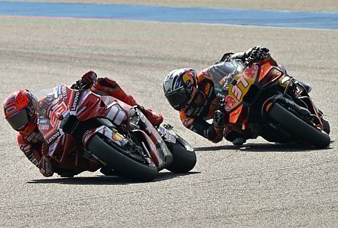 Spain's rider Marc Marquez, front, of Ducati Lenovo Team steers his motorcycle followed by Spin's rider Pedro Acosta, right, of Red Bull KTM Factory Racing during the MotoGP sprint race at the Chang International Circuit in Buriram, Thailand.