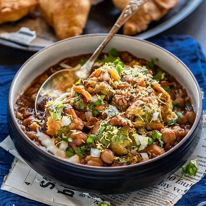 Samosa chaat with chickpeas, yogurt, and sev.