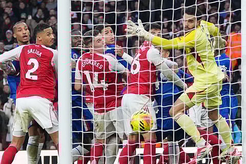 Arsenal's goalkeeper David Raya watches as he's beaten by the ball during the Premier League soccer match between Chelsea Arsenal in London.