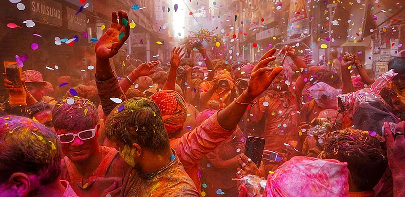 Crowd celebrating Holi with vibrant colors