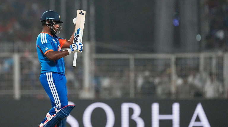 India's Sanju Samson applauds a shot by batting partner Tilak Varma during the T20 World Cup cricket match between India and West Indies in Kolkata, India, Sunday, March 1, 2026. - (AP Photo/Bikas Das)