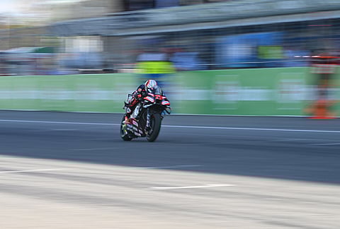 Italy's Marco Bezzecchi of Aprilia Racing steers his motorcycle during the MotoGP at the Chang International Circuit in Buriram, Thailand.