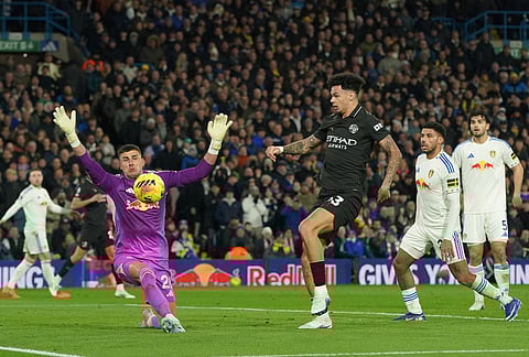Manchester City's Nico O'Reilly misses during the Premier League soccer match between Leeds United and Manchester City in Leeds, England.