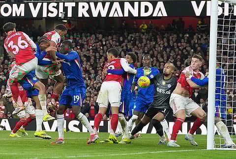 Arsenal's Jurrien Timber, third left, scores during the Premier League soccer match between Chelsea Arsenal in London.