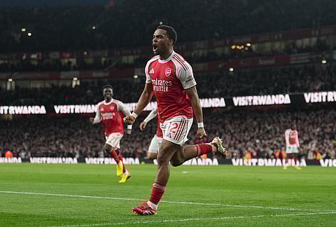 Arsenal's Jurrien Timber celebrates after scoring during the Premier League soccer match between Chelsea Arsenal in London.