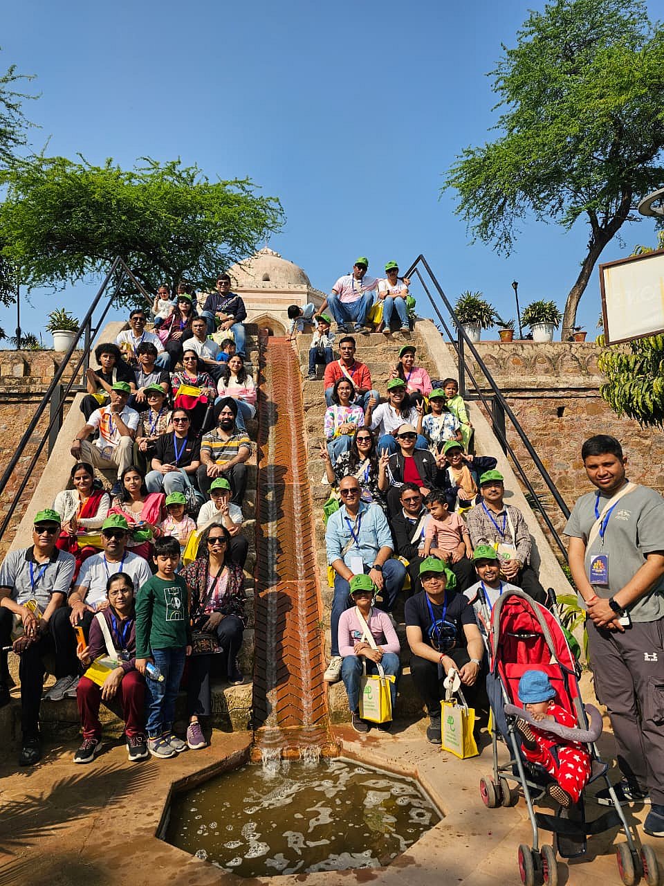 A group of people posing for the Delhi Tourism Heritage Walk initiative