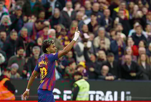 Barcelona's Lamine Yamal celebrates scoring his side's 3rd goal during the Spanish La Liga soccer match between Barcelona and Villareal in Barcelona, Spain.