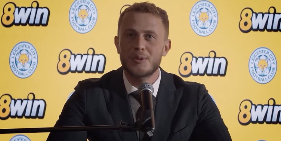 A representative of 8win addressing the media during an official announcement event.