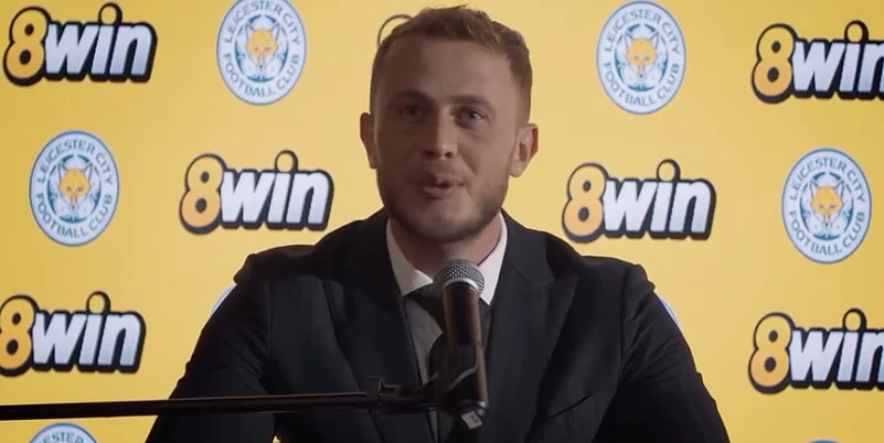 A representative of 8win addressing the media during an official announcement event.