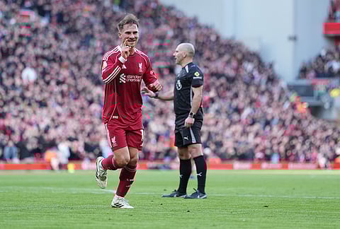 Liverpool's Alexis Mac Allister celebrates after scoring during the Premier League soccer match between Liverpool and West Ham United in Liverpool, England.