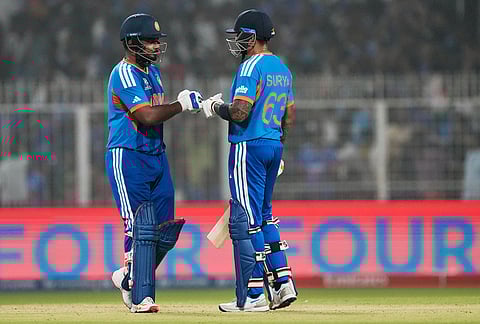 India's captain Suryakumar Yadav, right, and batting partner Sanju Samson touch gloves during the T20 World Cup cricket match between India and West Indies in Kolkata.