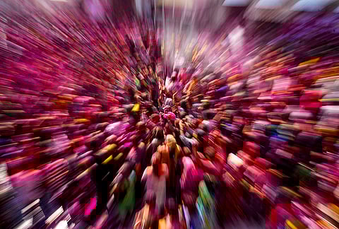 People daubed in vibrant colours during celebrations for the ‘Holi’ festival, at Shri Durgiana Temple in Amritsar.
