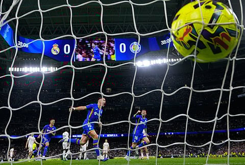 Getafe's Satriano celebrates the opening goal during a Spanish La Liga soccer match between Real Madrid and Getafe in Madrid, Spain.