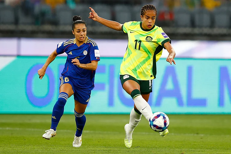 Australia's Mary Fowler kicks the ball clear of Philippines' Jaclyn Sawicki, left, during the Women's Asia Cup soccer match between Australia and the Philippines in Perth, Australia. - | Photo: AP/Gary Day