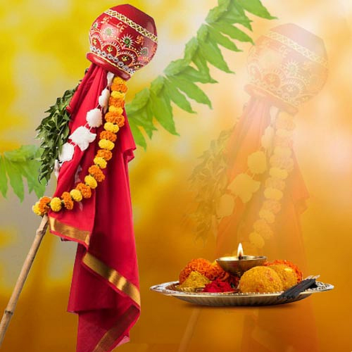 Decorated Gudi with red cloth, garland, and festive offerings for Gudi Padwa