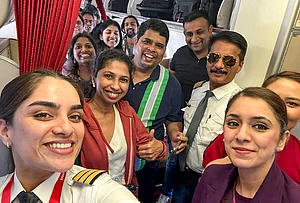 | Photo: @AirIndia_News/X via PTI : Passengers and crew of Air India flight AI916D from Dubai arrive at the Indira Gandhi International Airport, in New Delhi. The airline said the flight was the first by an Indian carrier to land in the national capital amid the ongoing conflict in the Middle East.