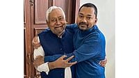 Nitish Kumar’s Son to Take On Key Role in JD(U), Formal Announcement Soon | Photo: PTI | Representative : Bihar Chief Minister Nitish Kumar with his son Nishant Kumar at his official residence, in Patna.