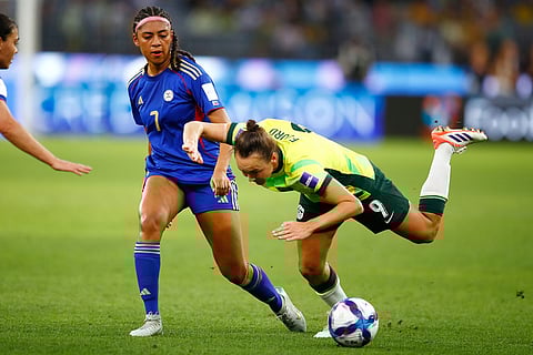 Australia's Caitlin Foord, right, and Philippines' Jael Guy compete for the ball during the Women's Asia Cup soccer match between Australia and the Philippines in Perth, Australia.