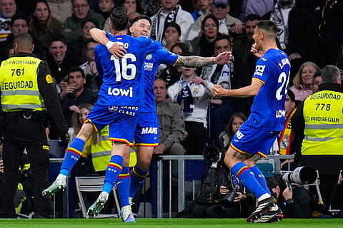 Getafe's Satriano celebrates the opening goal during a Spanish La Liga soccer match between Real Madrid and Getafe in Madrid, Spain.