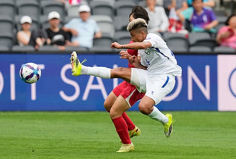 Uzbekistan's Dilrabo Asadova right, battles for the ball with North Korea's Chae Un Yong during the Women's Asia Cup soccer match between North Korea and Uzbekistan in Sydney.